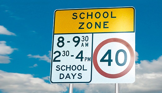 School zone road sign with 40km per hour speed limit